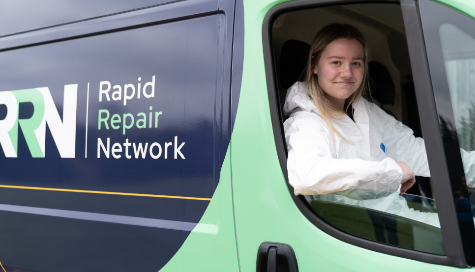 rrn_repair-process-02 Female mobile repair technician smiling whilst in van